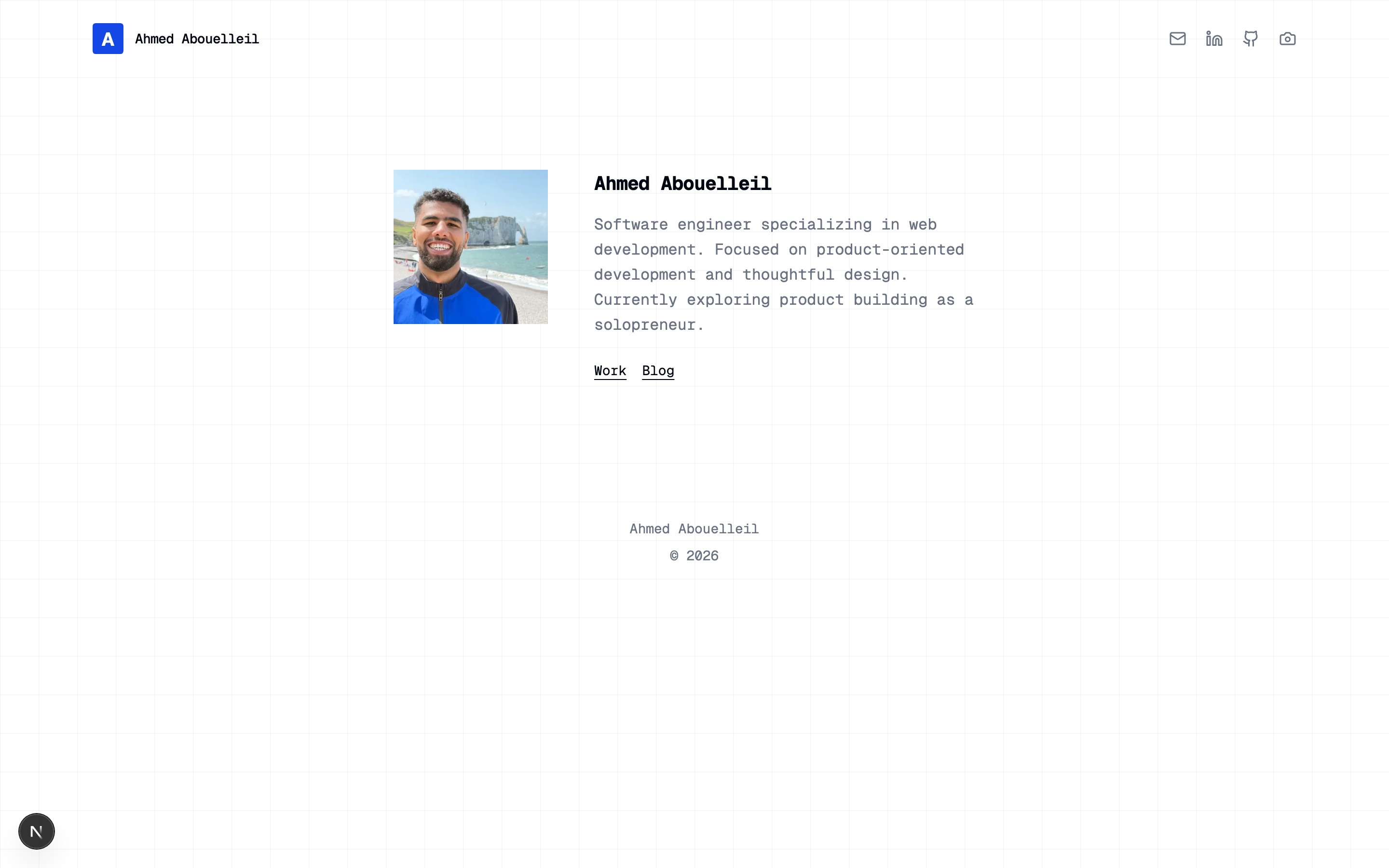 A minimal portfolio homepage with a portrait, a four-line bio, and Work / Blog links